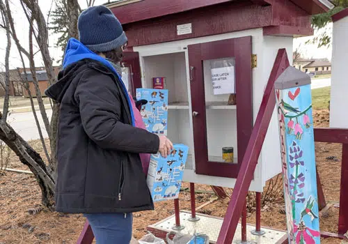 Micro Pantry Volunteers spend time donating to local micro pantry food boxes.