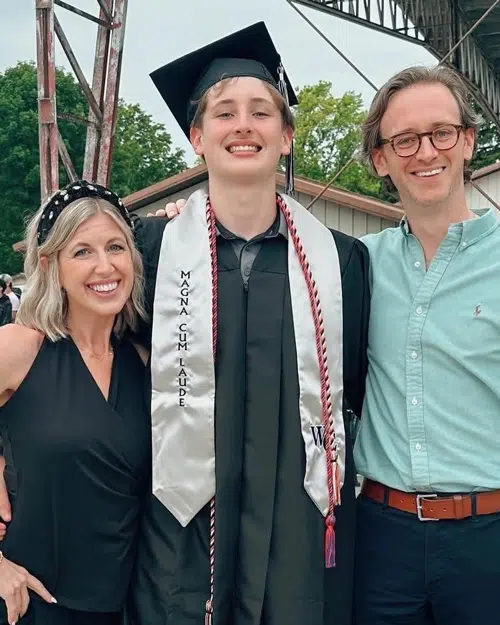 Charles HS Grad 2026 Charles smiling with parents after class of 2026 Graduation.