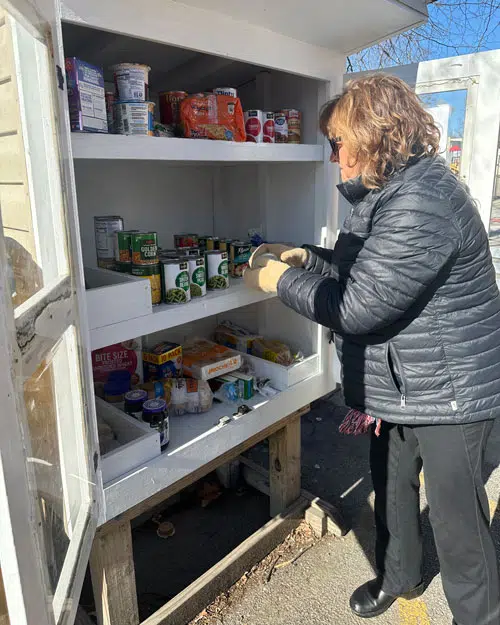 Micro Pantry Volunteers spend time donating to local micro pantry food boxes.