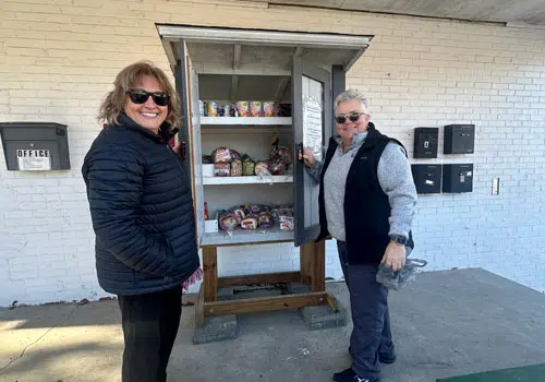 Micro Pantry Volunteers spend time donating to local micro pantry food boxes.