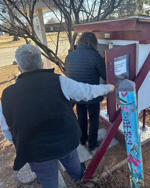 Micro Pantry Volunteers spend time donating to local micro pantry food boxes.