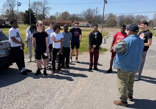Mound Bayou Trip Group of youth services men and boys listening to a speaker during a spring break trip to Mound Bayou.