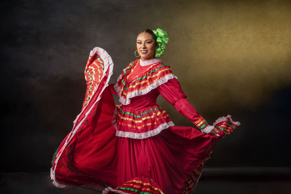 a-woman-in-a-red-dress-is-dancing-and-smiling_web