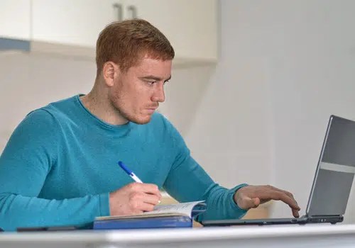 entrepreneur-man-on-the-phone-working-with-a-laptop_web
