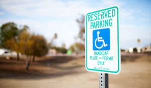 handicap parking sign in a parking lot