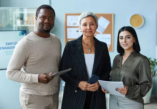 multiethnic-business-team-with-senior-woman-standing_wen